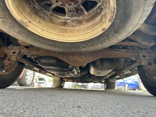 This Rusted Toyota Camry Has Fender Flares Made From License Plates