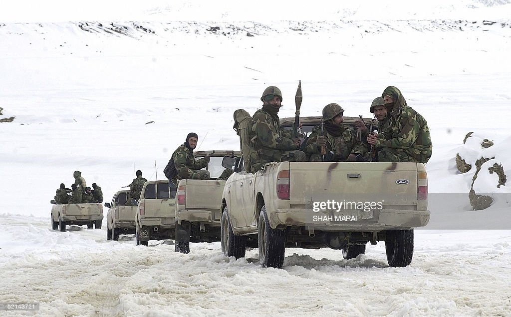 afghan-national-army-soldiers-sit-at-the-back-of-pickup-trucks-as-picture-id52143721.jpg