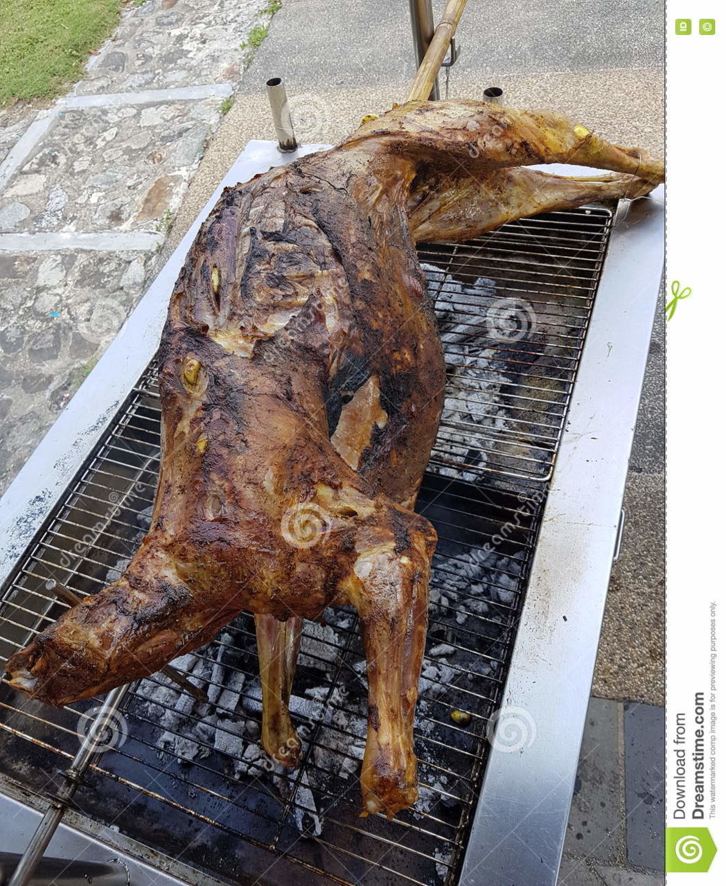 whole-grilled-lamb-barbeque-pit-74783016.jpg